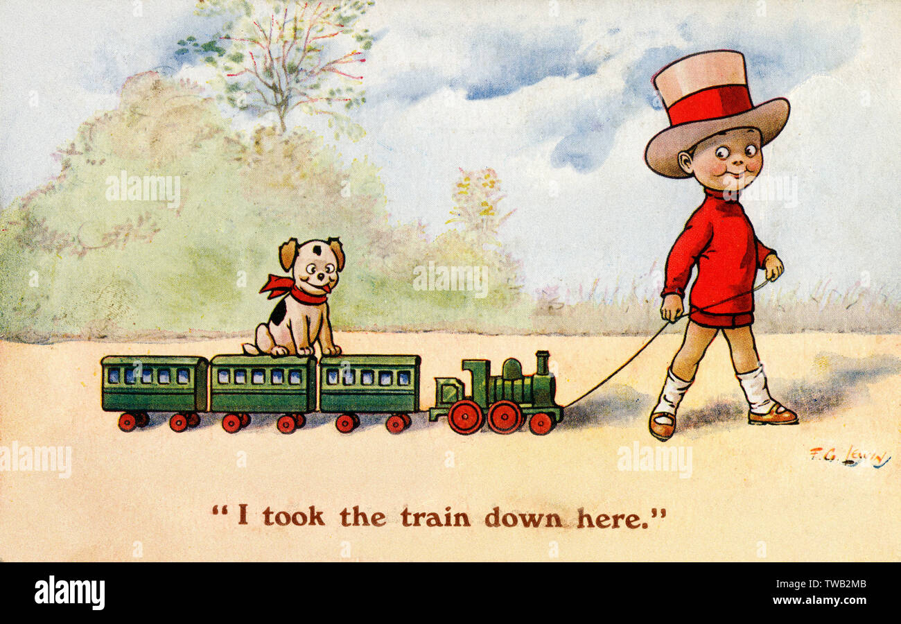 Young boy pulls along his toy train - puppy takes a ride too Stock Photo
