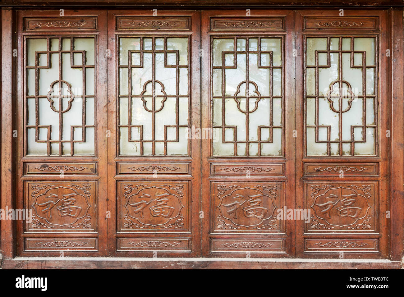 Chinese style doors and windows hi-res stock photography and