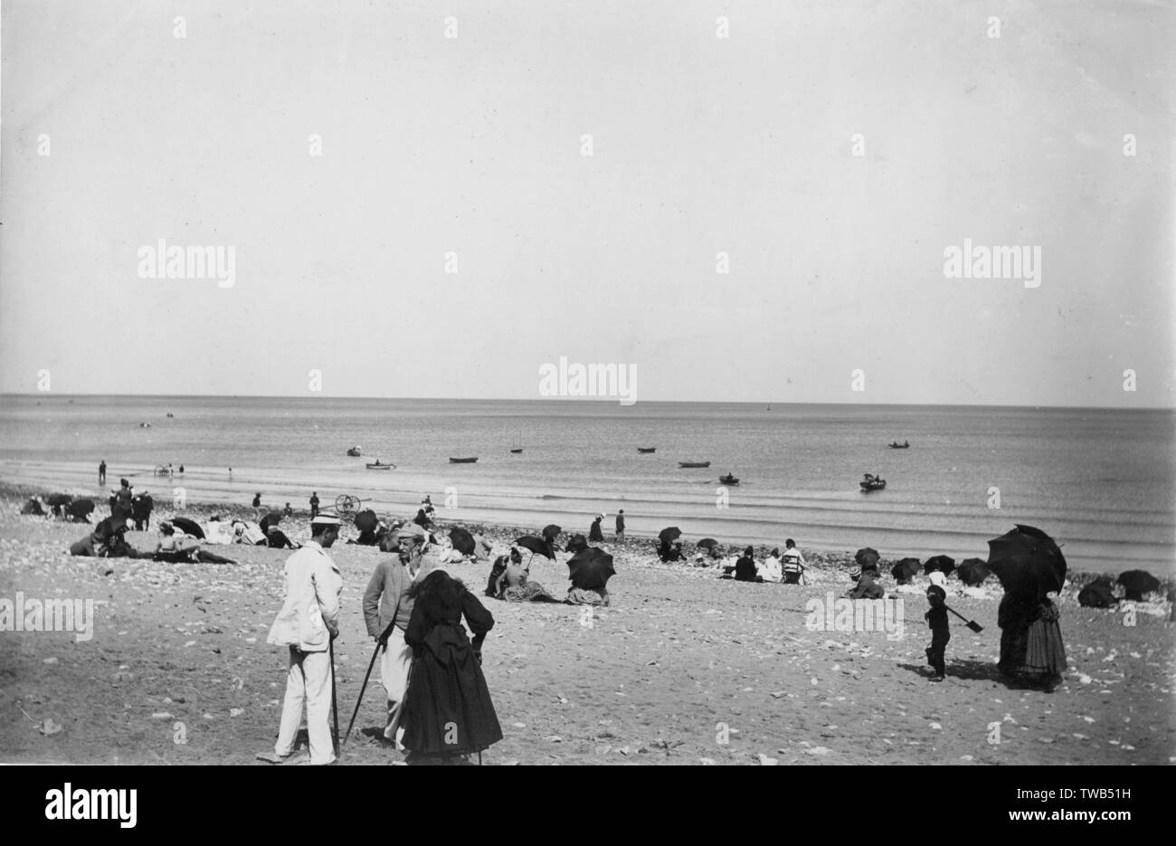 People on the beach at Colwyn Bay, North Wales Stock Photo