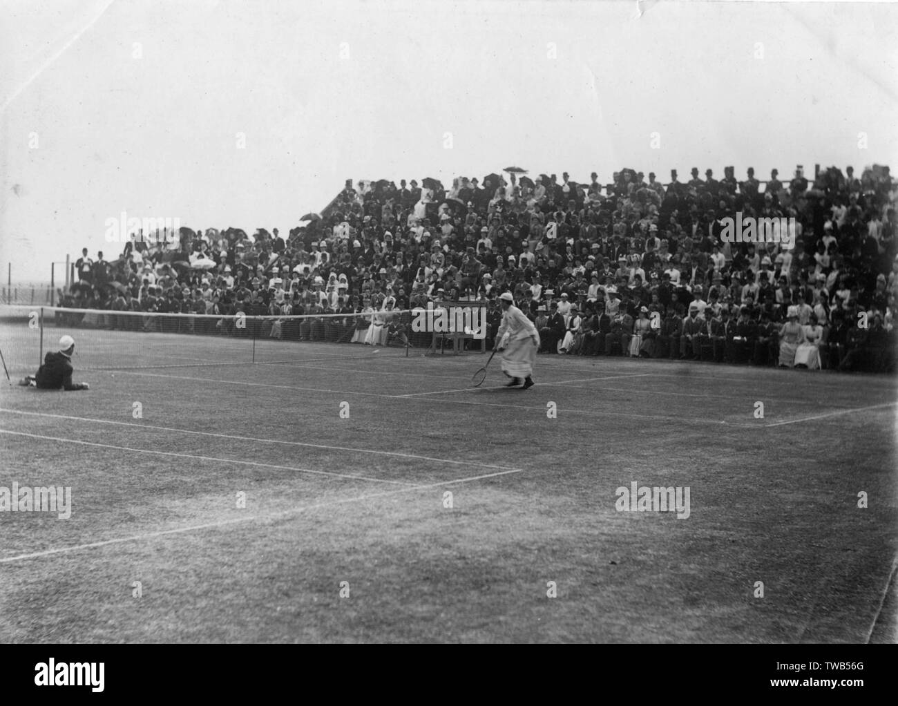 Charlotte (Lottie) Dod (1871-1960), English tennis player, taking part in the Northern Tournament, Manchester, 22 June 1889, in a match against Blanche Bingley, which she won. She was the youngest woman to win the ladies' singles championship at Wimbledon in 1887 at the age of 15 1889 Stock Photo