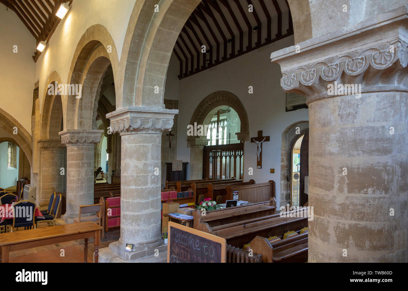 Norman arches inside village parish church of the Holy Cross, Sherston