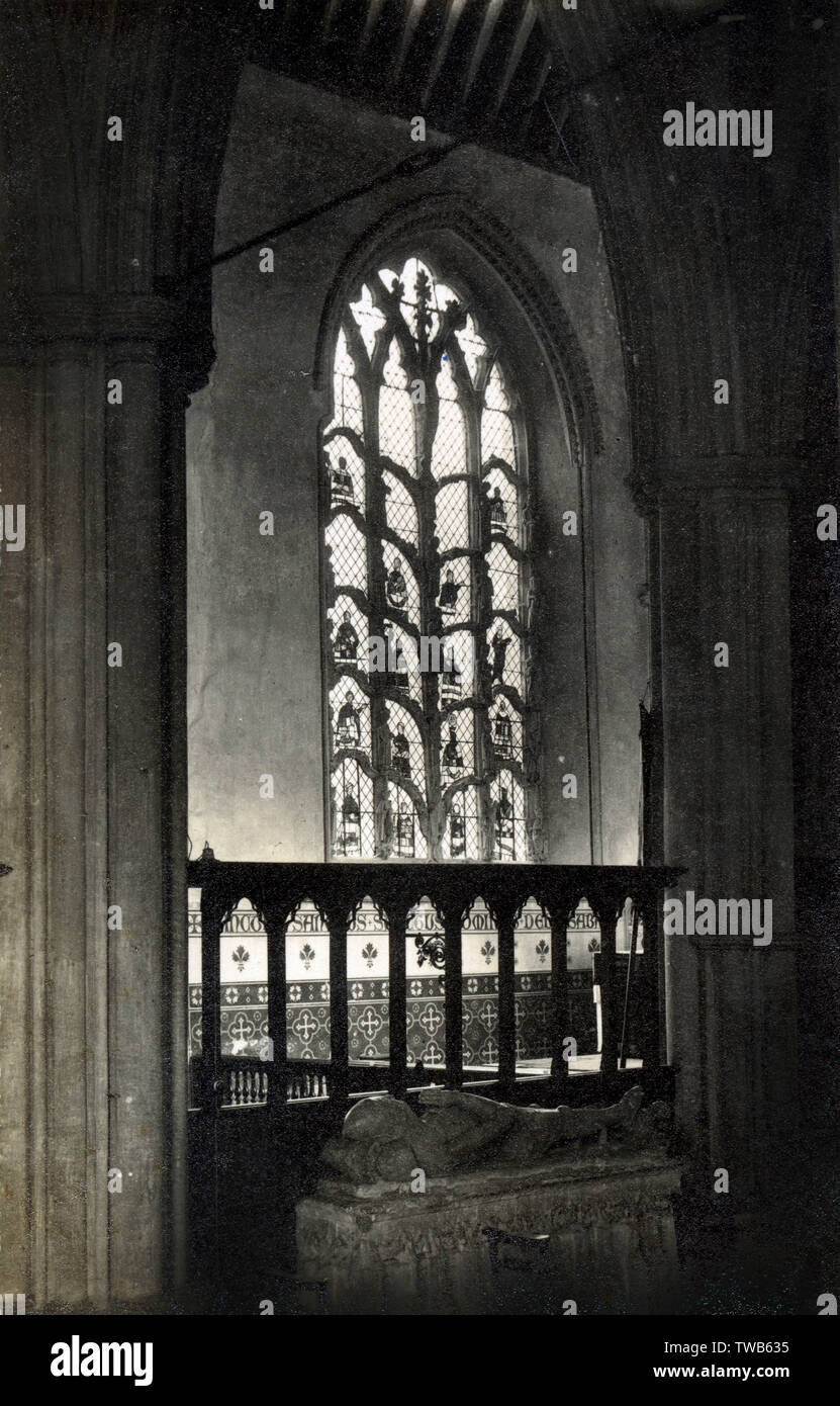 Jesse Window - Dorchester Abbey, High Street, Dorchester-on-Thames, Oxfordshire.. The window on the north wall of the chancel is a Tree of Jesse, a unique form of multi-media combining tracery, sculpture and stained glass (all 14th century in date) in a single theme. The scene shows how Christ was descended from King Davids ancestor Jesse, the surprisingly natural figure apparently slumbering on the windowsill at the foot of the tree. The figure of Christ at the top was severely damaged in Cromwellian times. Date: 1934 Stock Photo