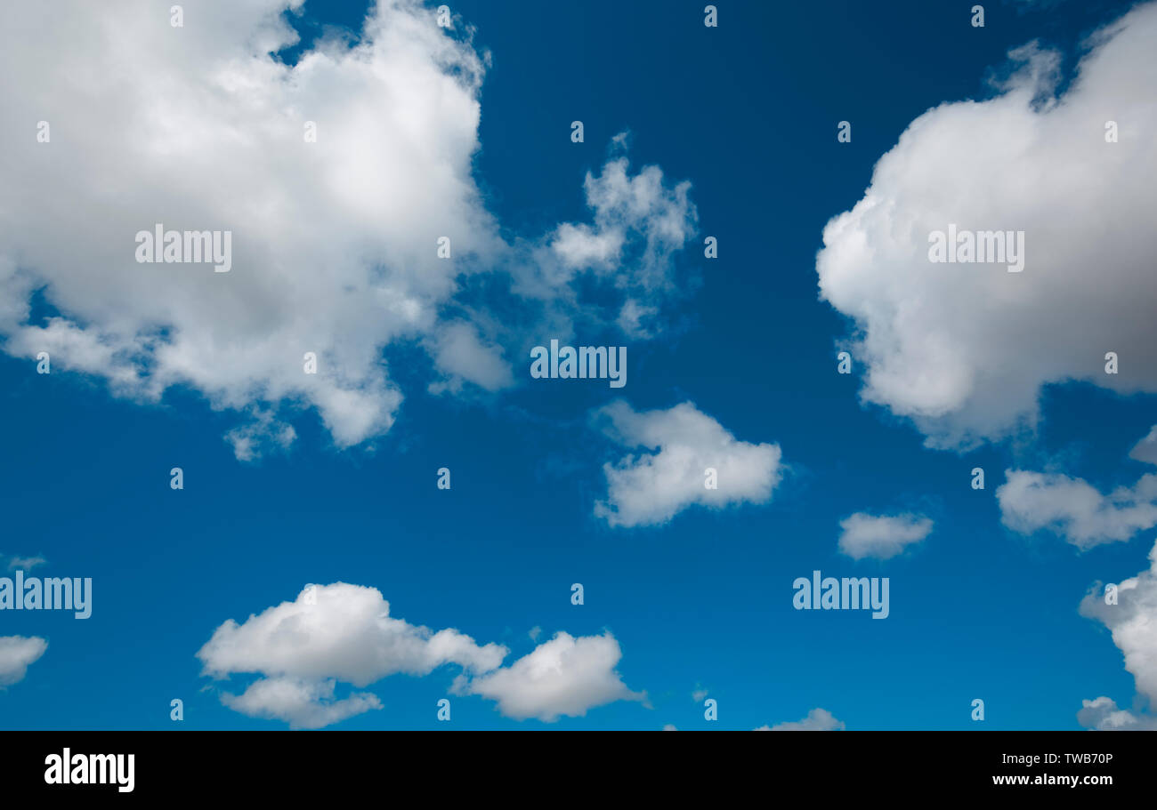 Fair weather cumulus and deep blue sky Stock Photo