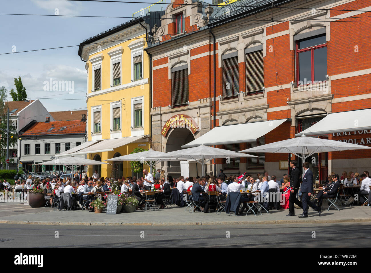 Oslo cafe bar, view of Norwegian people relaxing at terrace tables outside the Schous brewery