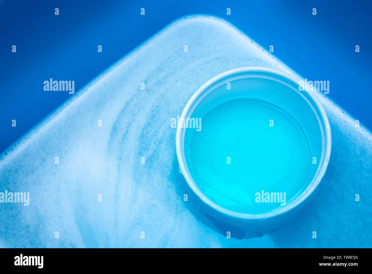 Abstract blue and turquoise water container background buckets Stock Photo
