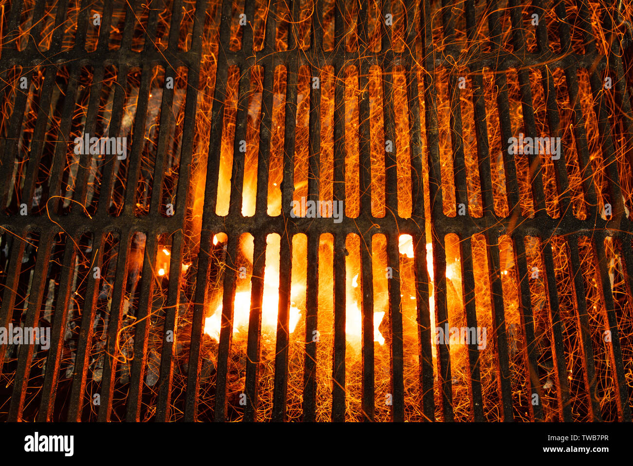 bar-b-cue grill barbecue with red ashes and sparkles in fire Stock Photo