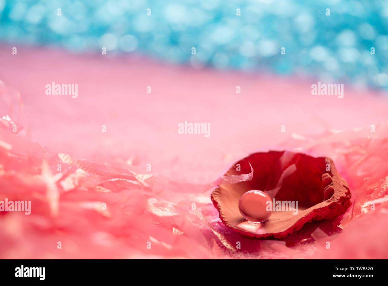Microplastic pollution in ocean sea concept pearl shell in the beach Stock Photo