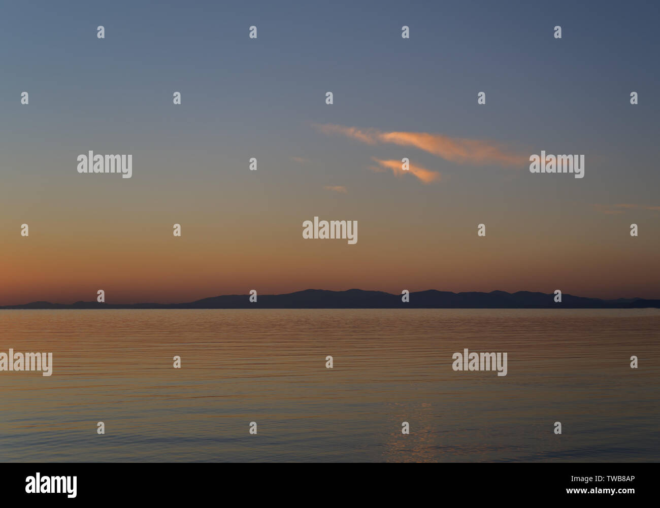 Beautiful sunset with clouds and sea Stock Photo - Alamy