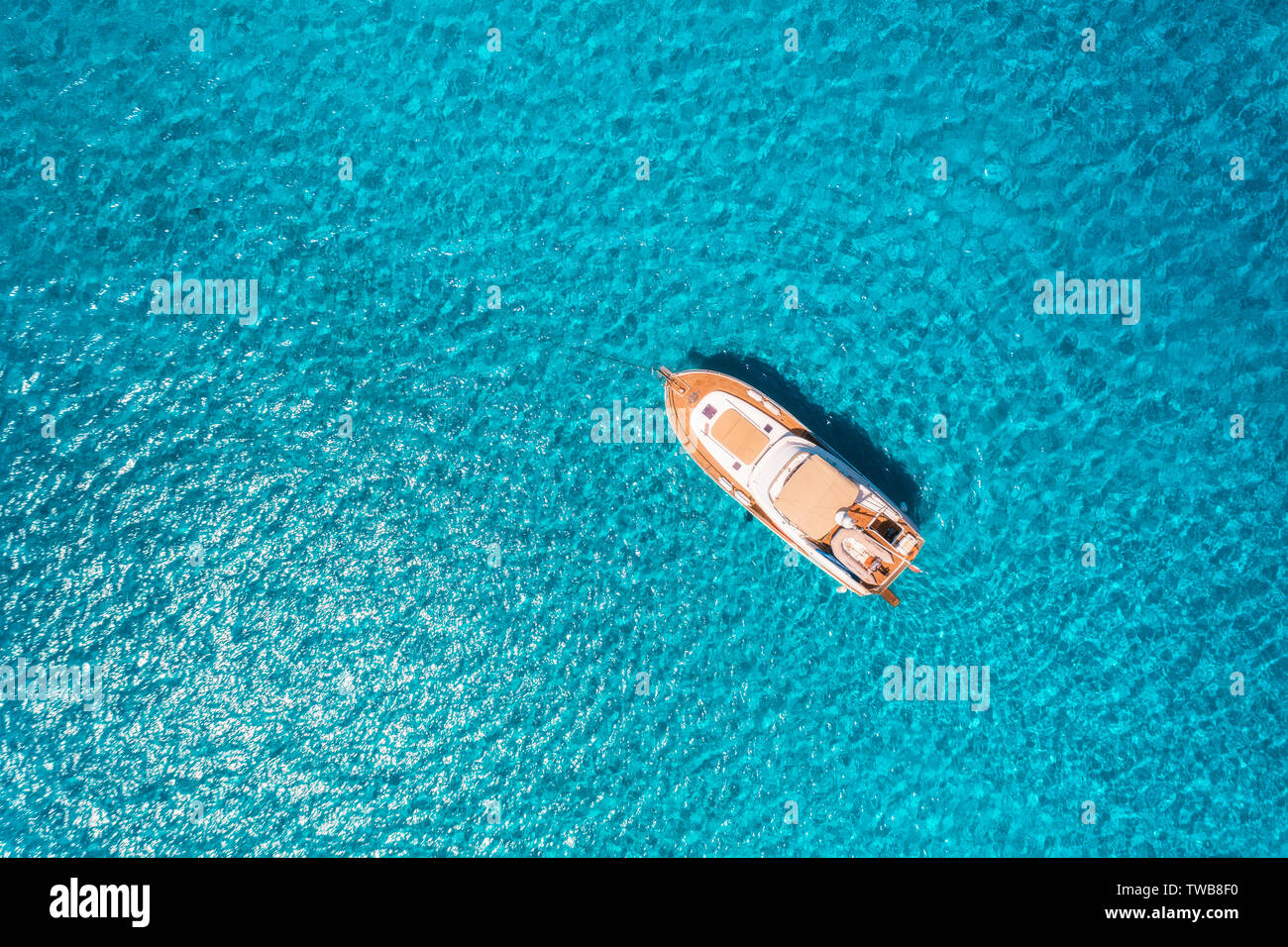 Aerial view of luxury yacht in transparent sea at sunny day Stock Photo ...