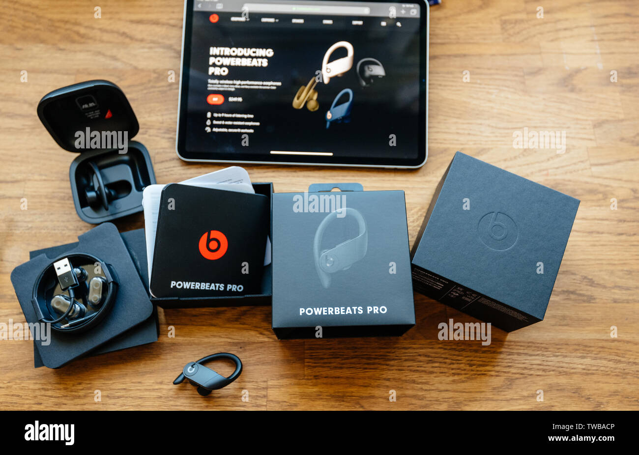 Paris, France - Jun 17, 2019: Unboxing of Powerbeats Pro Beats by Dr Dre wireless high-performance earphones waterproof and workout professional headphones Stock Photo