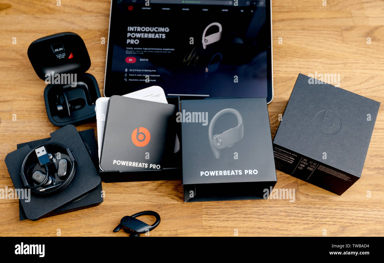 Paris, France - Jun 17, 2019: Unboxing of Powerbeats Pro Beats by Dr Dre wireless high-performance earphones waterproof and workout professional headphones Stock Photo