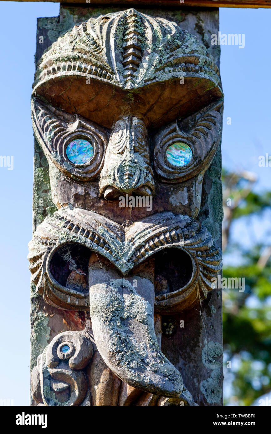 Maori Carvings on The Entrance Gate To A Cemetery, North Island, New Zealand Stock Photo