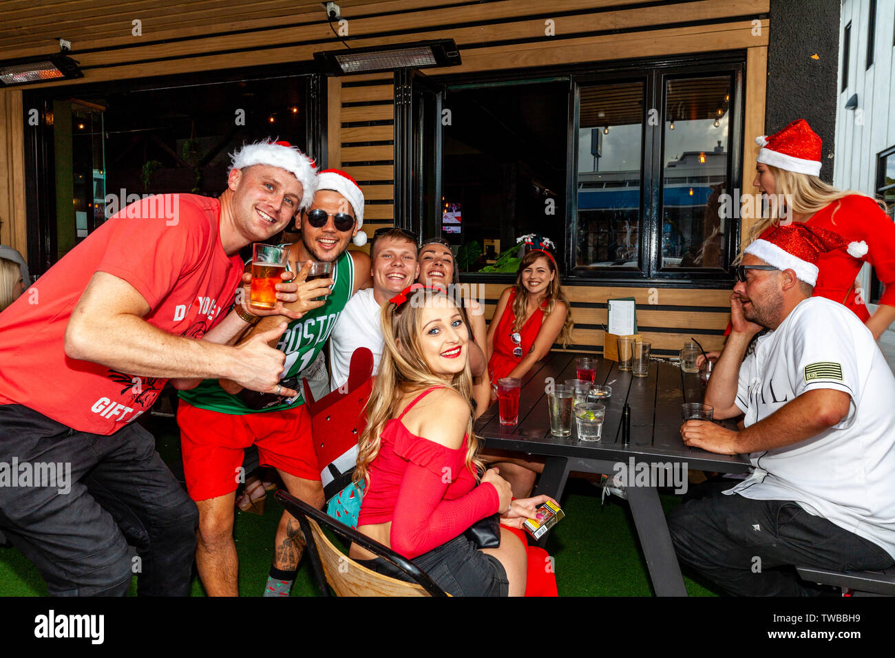 A Group Of Young People Celebrating Christmas, Whangarei, North Island, New Zealand Stock Photo