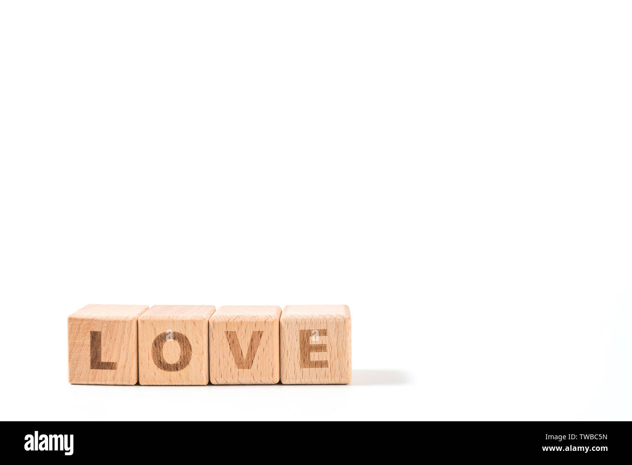 word LOVE on wood cube dices on white background. Stock Photo