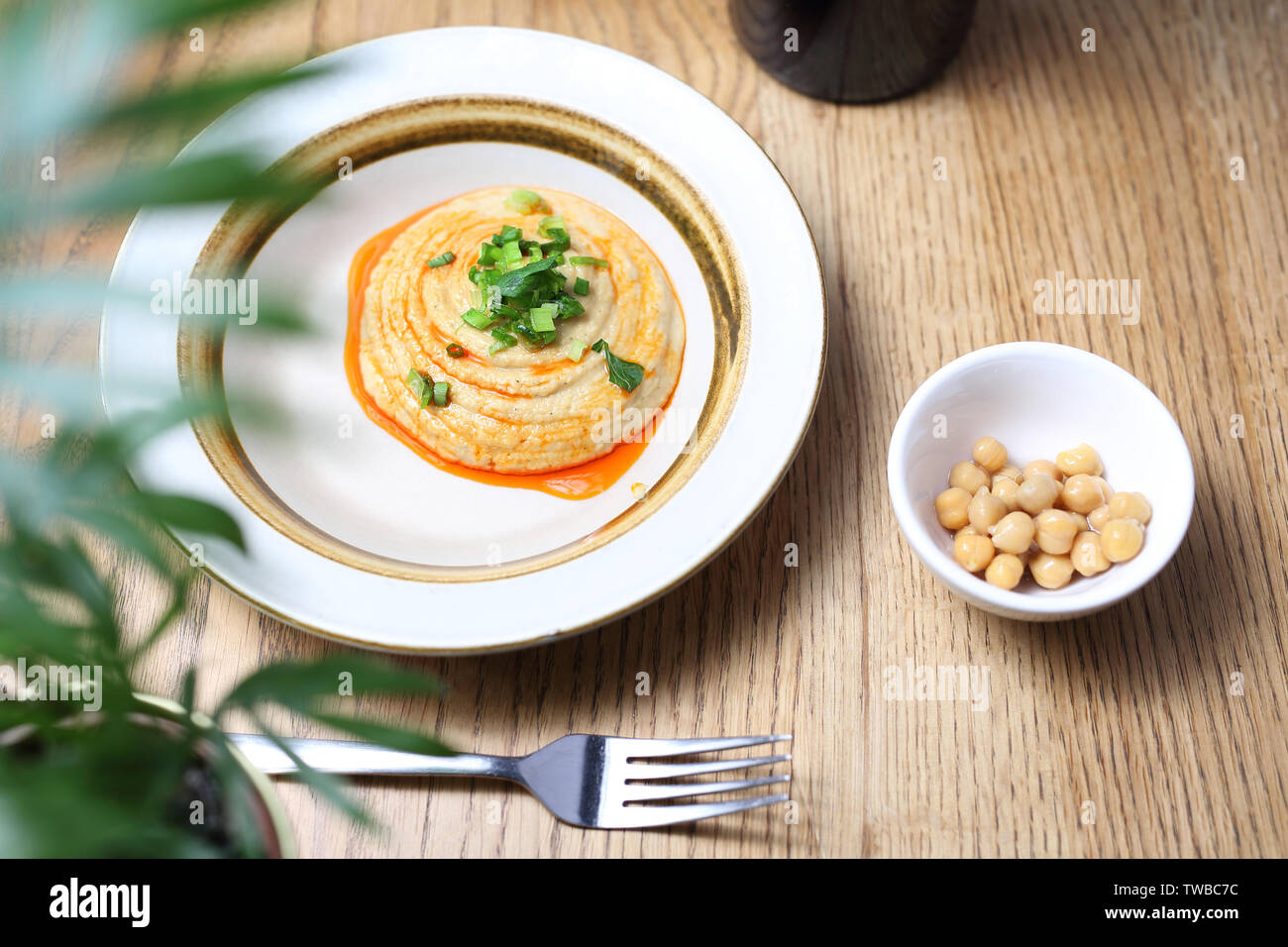 Chickpea paste and roasted onion, oriental snack. Stock Photo