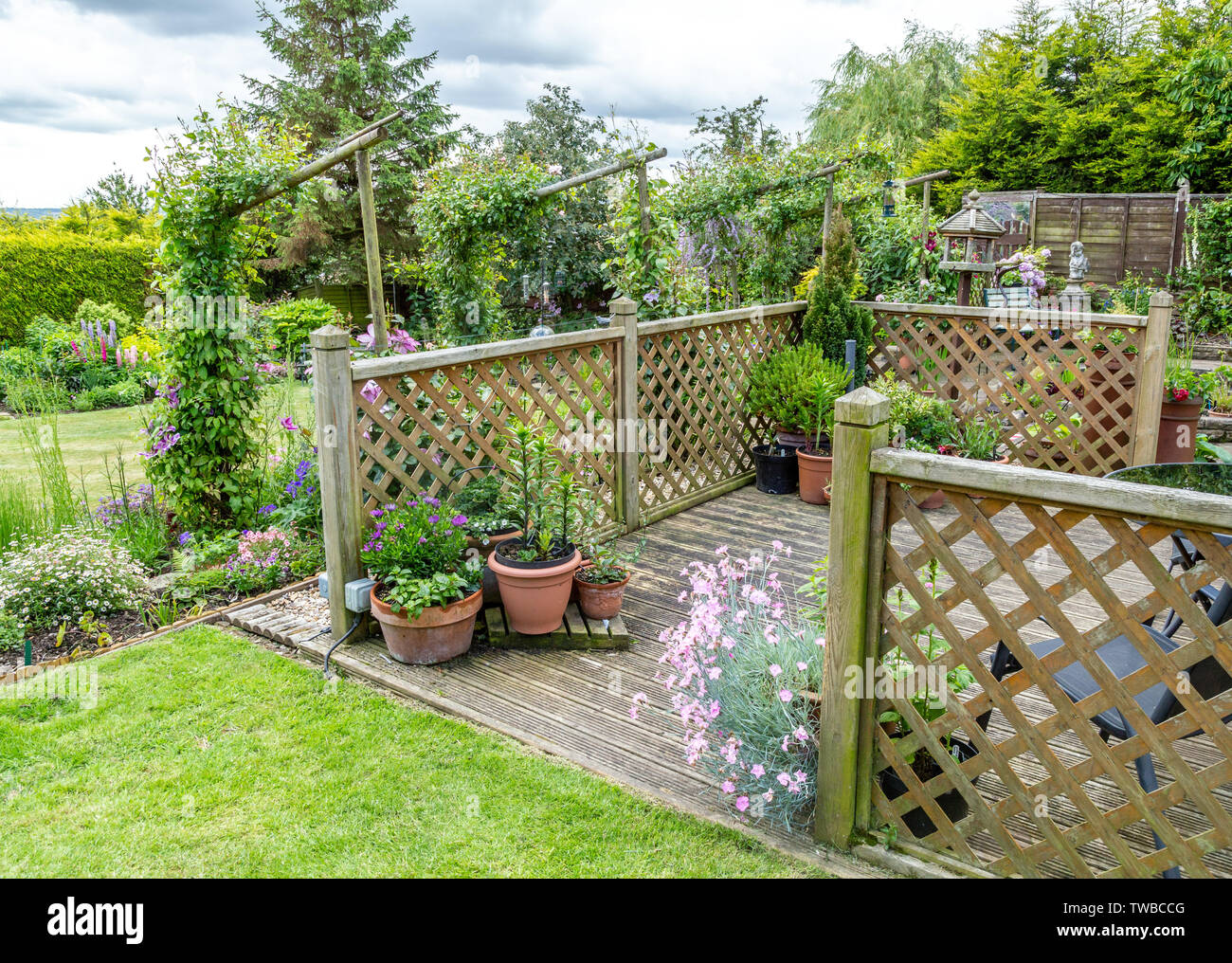 Garden decking area with planters. Stock Photo