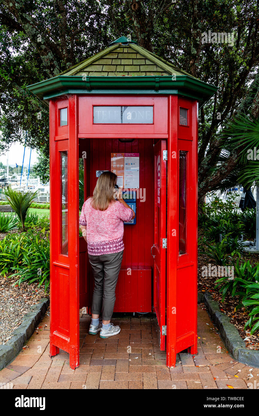 A Woman Using A Public Phonebooth, Whangarei, North Island, New Zealand Stock Photo