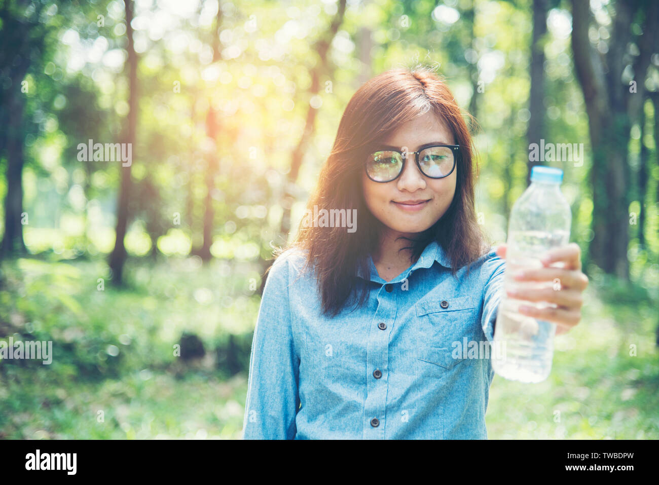 https://c8.alamy.com/comp/TWBDPW/beautiful-girl-drinks-water-from-a-bottle-on-the-nature-TWBDPW.jpg