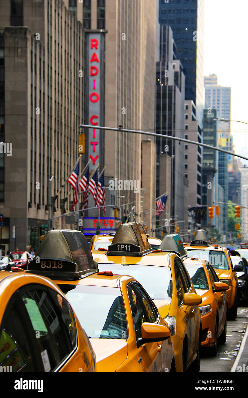 New York taxis waiting at Radio City Music Hall, New York City, New York, USA Stock Photo