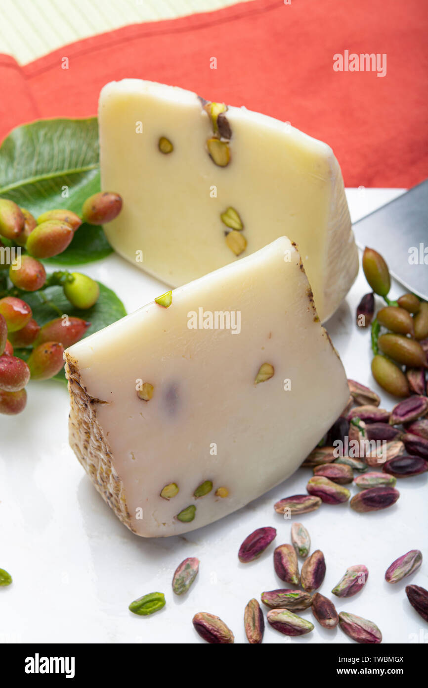 Cheese collection, white provola green in pistachio marble Alamy on provolone tasty Bronte with served or nuts cheese Photo made Sicily plate Italian up close - Stock