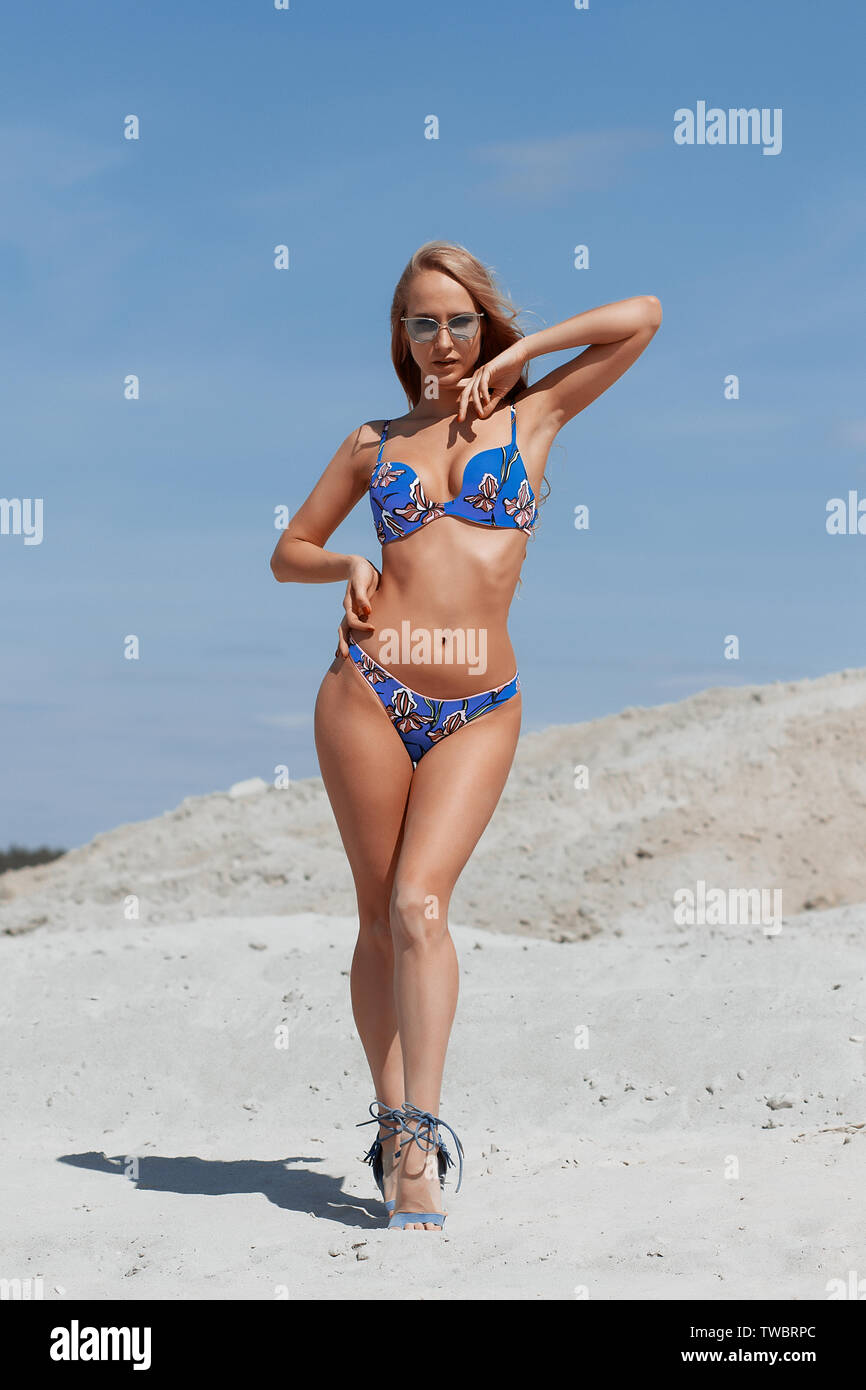 Beautiful young girl in a sexy bikini on the beach Stock Photo - Alamy