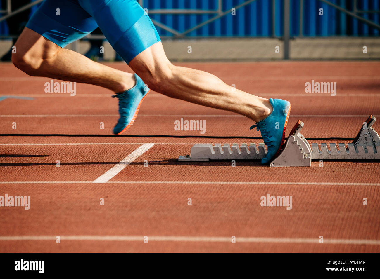 feet runner sprinter fast start to run from starting blocks Stock Photo