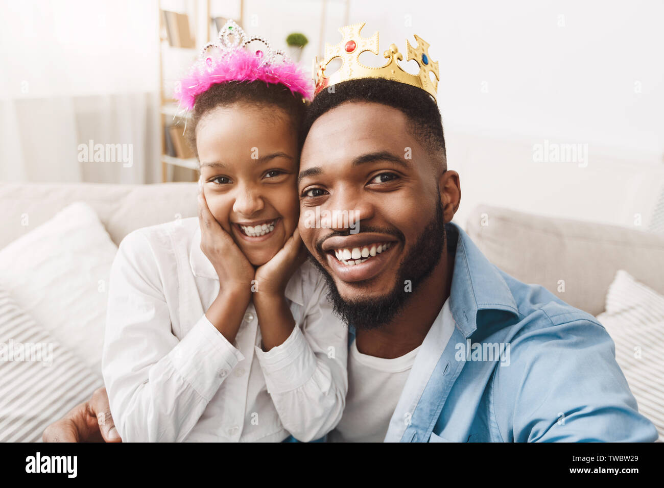 Play Princess. Father and Daughter In Crowns Taking Selfie, Having Fun ...