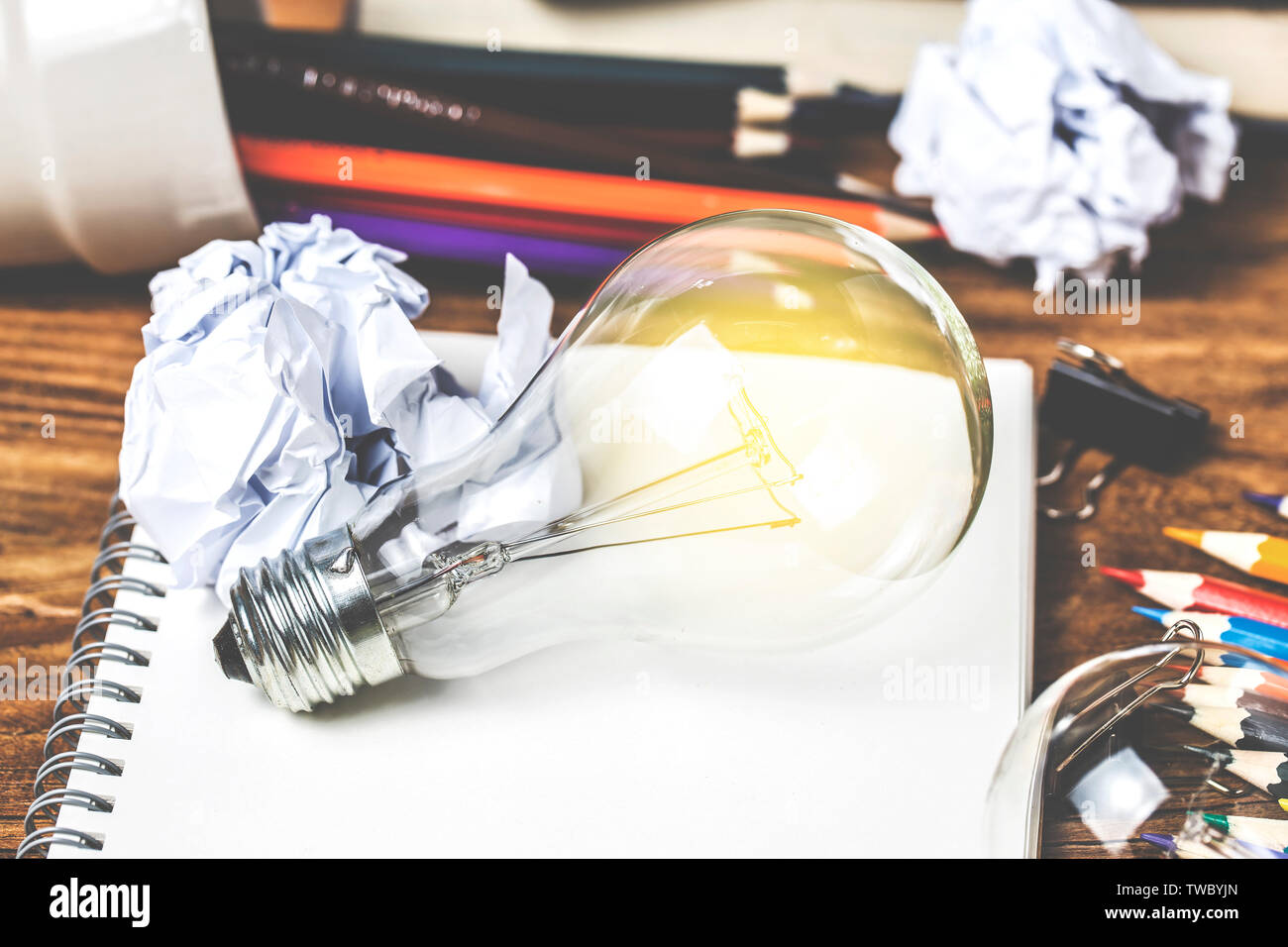 great idea concept with crumpled office paper and light bulb standing