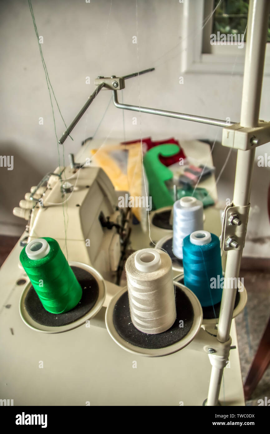 Industrial sewing machine installed in a sewing Stock Photo