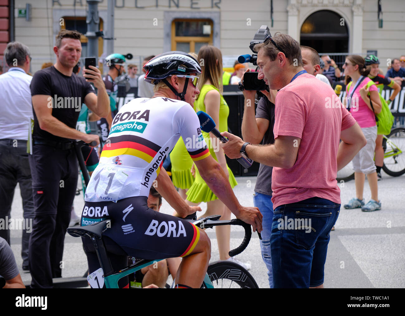 Pascal Ackermann of Team Bora - Hansgrohe being interviewed by RTV SLO prior to departure of Tour of Slovenia stage one race, Ljubljana, June 2019 Stock Photo