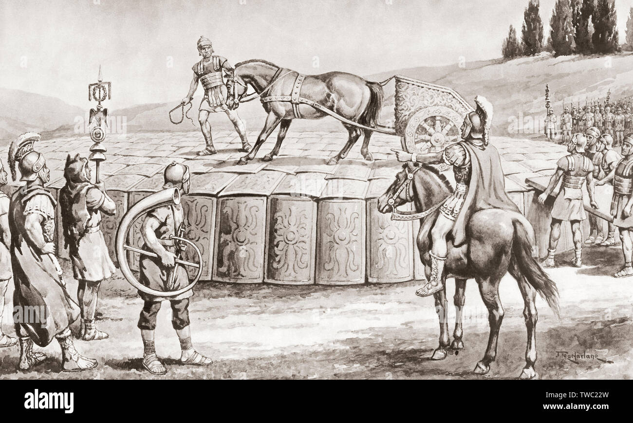 A Roman military exercise in the days of Julius Caesar, testing the Testudo - a military chariot being driven onto the roof of a Testudo or Tortoise formation in order to test its strength. In the testudo formation, the men would align their shields to form a packed formation covered with shields on the front and top.  After a work by J. Macfarlane. From a contemporary print c.1935. Stock Photo