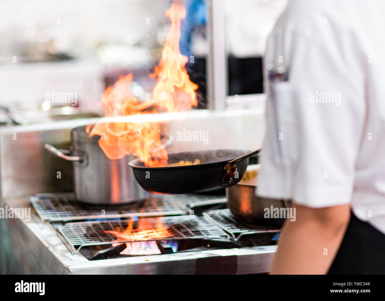 Chef cooking soup on stove hi-res stock photography and images - Alamy