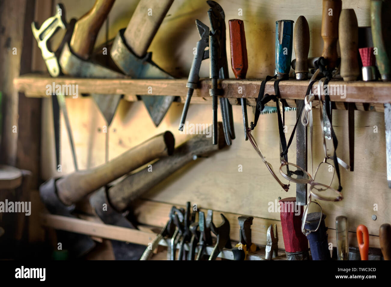 Old tools for carpentry work, hanging on rack Stock Photo - Alamy