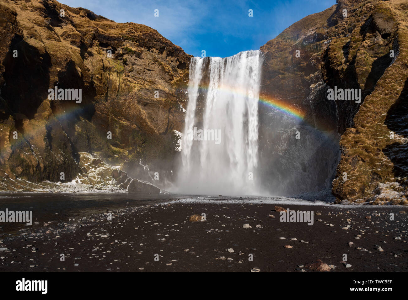 Skogafoss is one of Iceland’s biggest and most beautiful waterfalls with an astounding width of 25 meters and a drop of 60 meters, located in South Ic Stock Photo