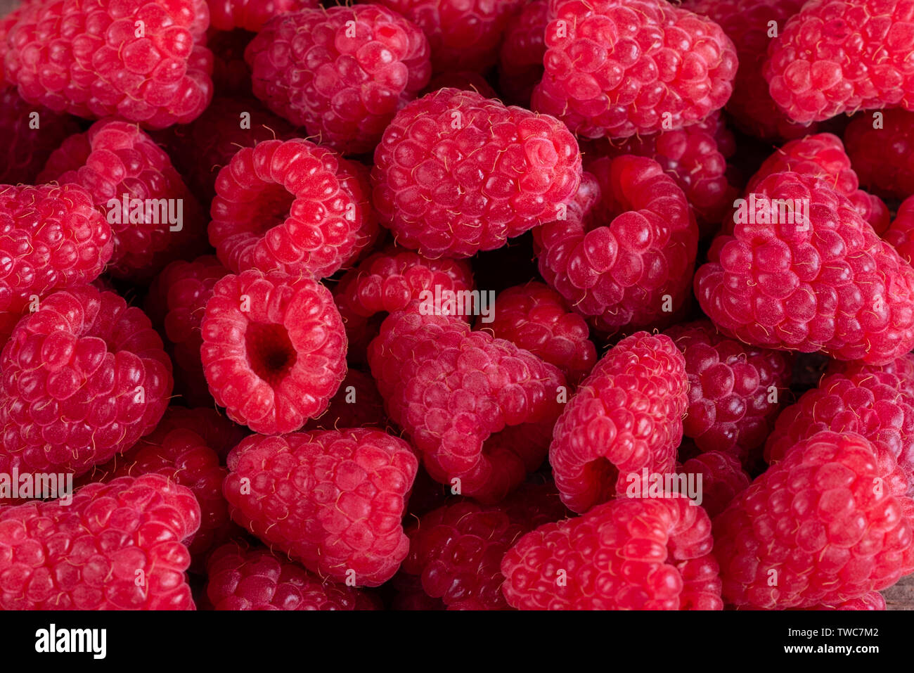 Organic Raspberries Sweets Sweet fresh organic raspberries background close-up. Fresh and sweet ...
