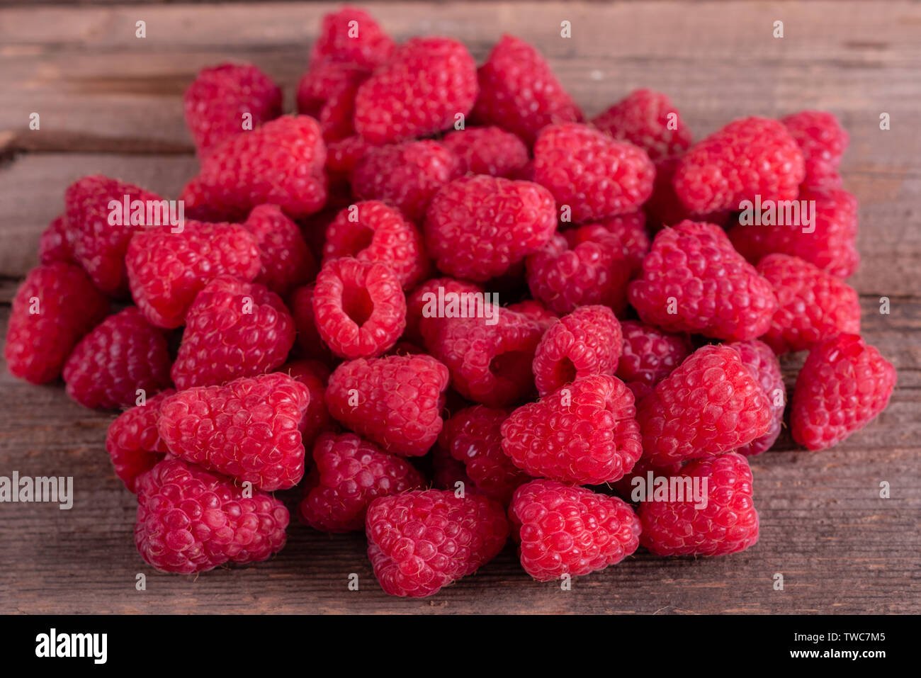 Organic Raspberries Sweets Sweet fresh organic raspberries background close-up. Fresh and sweet ...