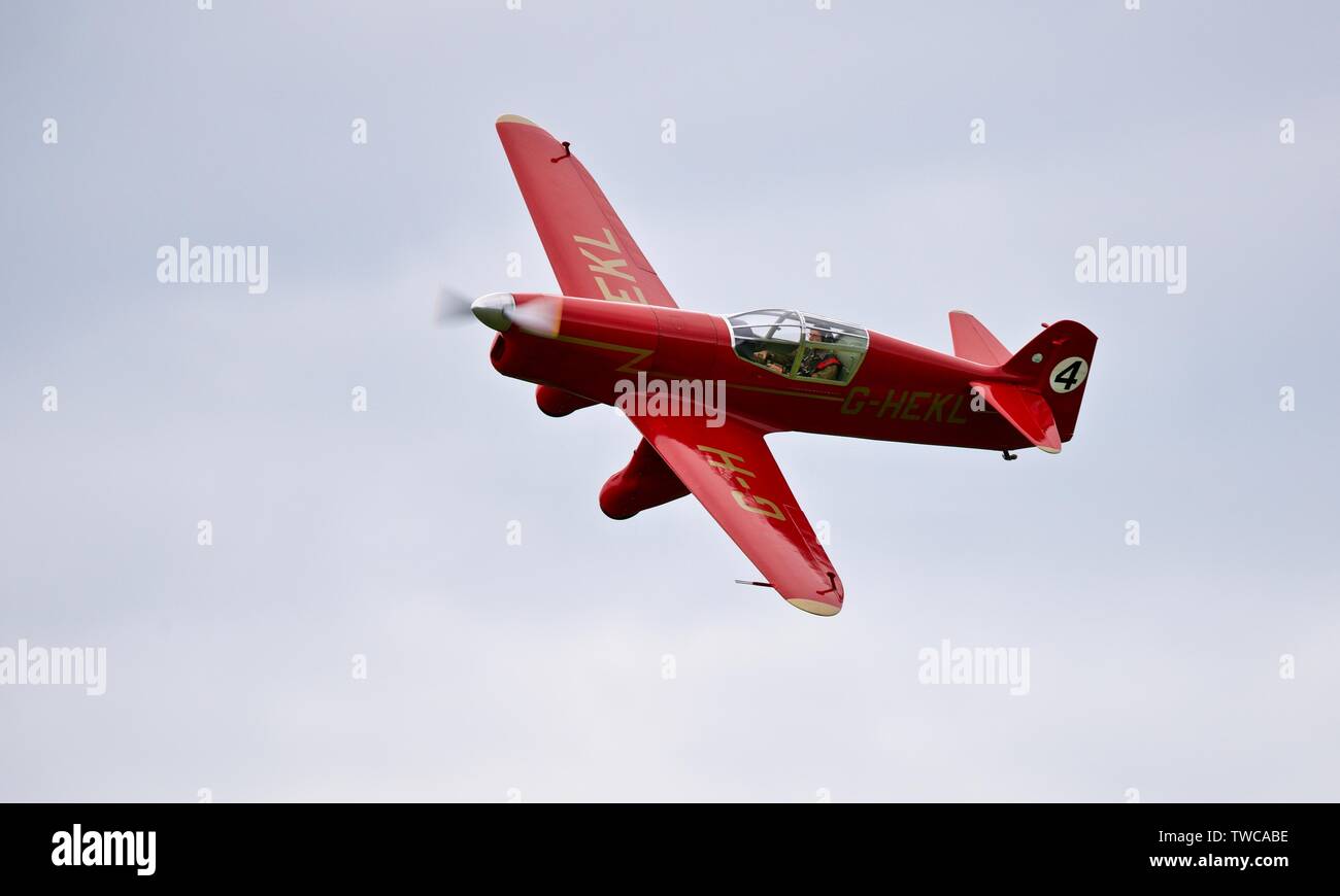 Percival Mew Gull (G-HEKL) airborne at the Shuttleworth Flying Festival on the 2rd June 2019 Stock Photo