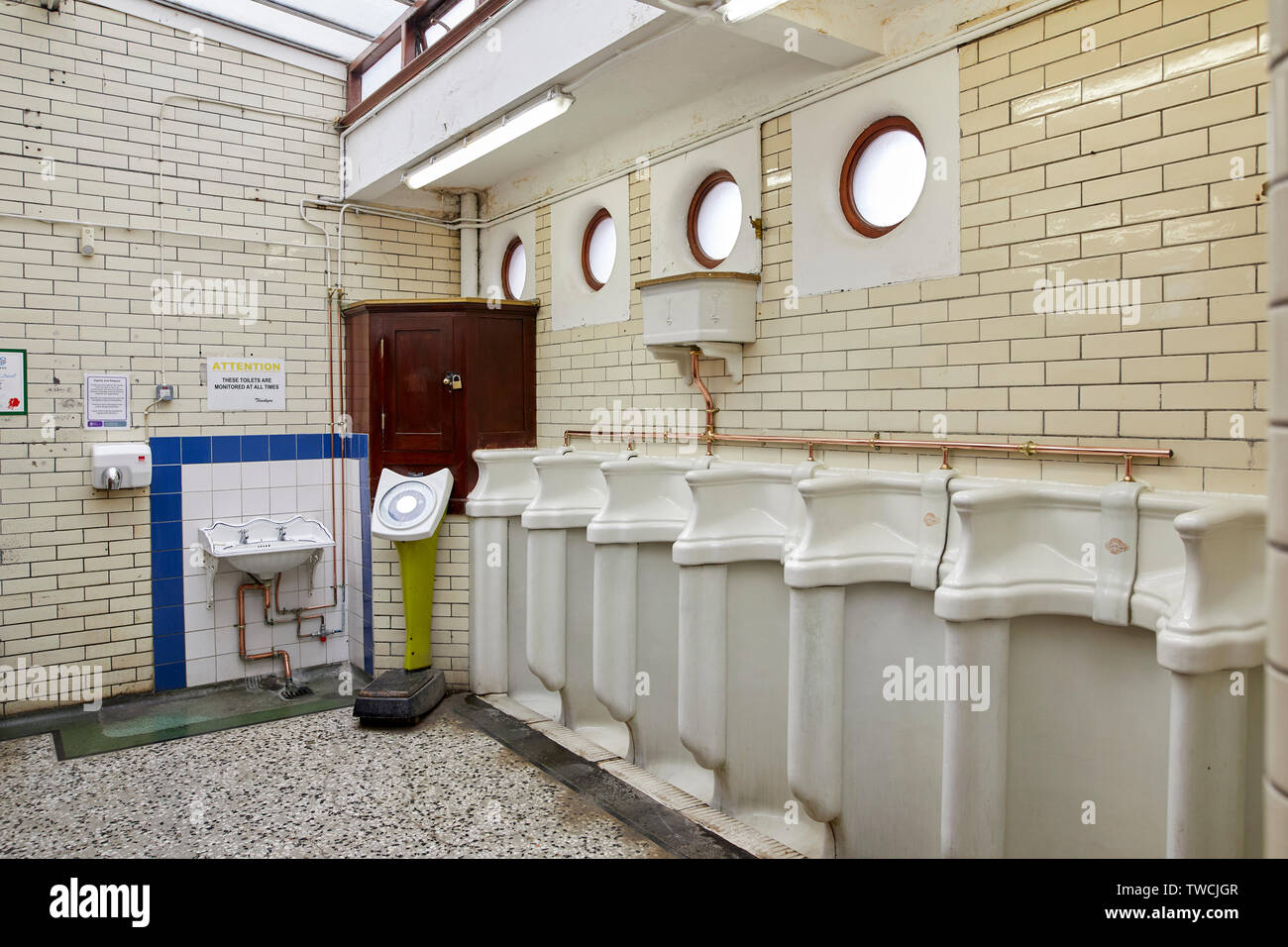Kingston upon Hull, free victorian mens public toilet interior tiled walls and urinals Stock Photo