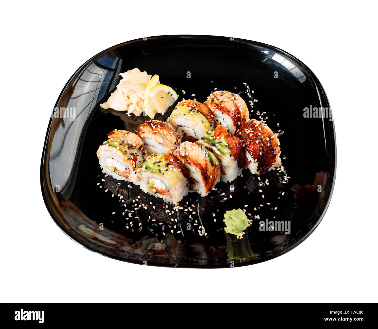 photo of Japanese rolls in a black plate Stock Photo