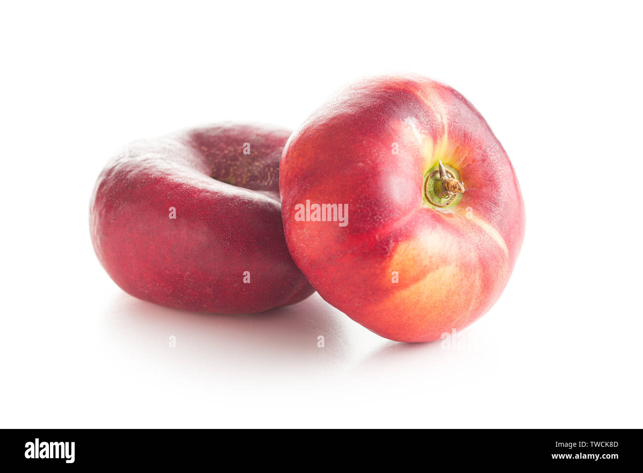 Ripe flat nectarines isolated on white background. Stock Photo