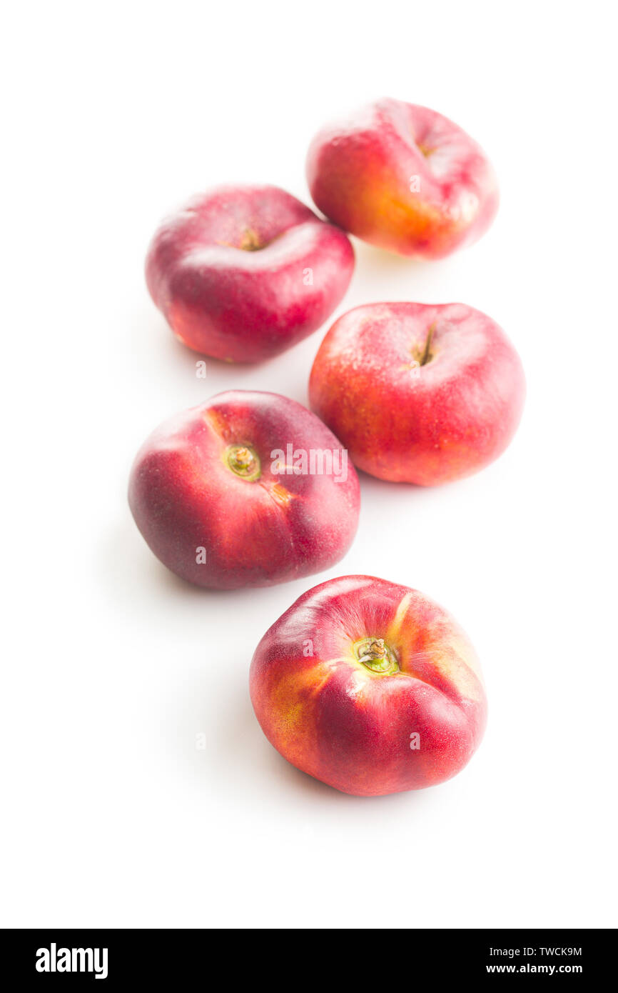 Ripe flat nectarines isolated on white background. Stock Photo