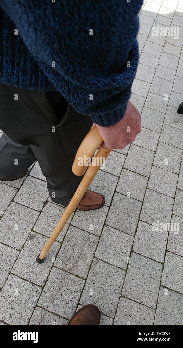 Man with walking stick Stock Photo