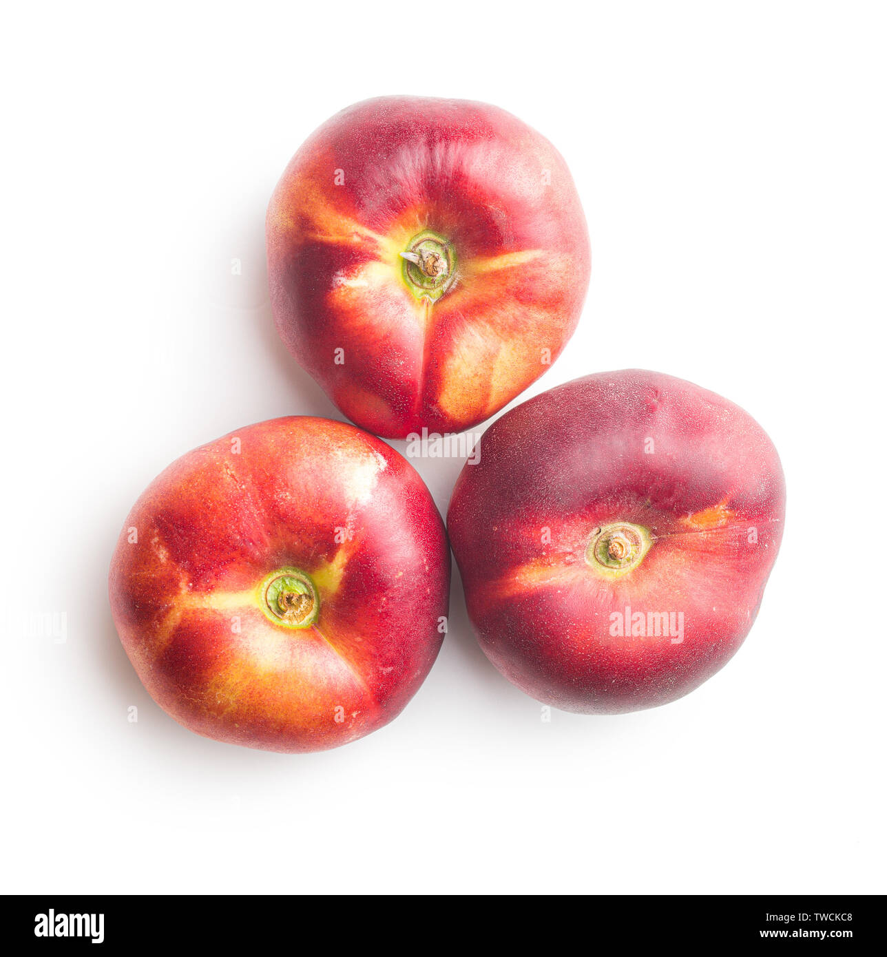 Ripe flat nectarines isolated on white background. Stock Photo