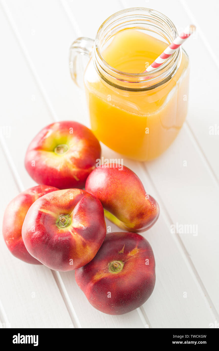 Glass of orange juice on flat table hires stock photography and images