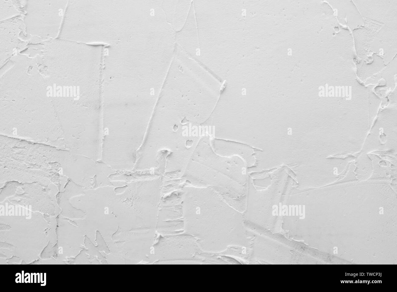 Texture of white plaster. Covering the concrete wall of the house