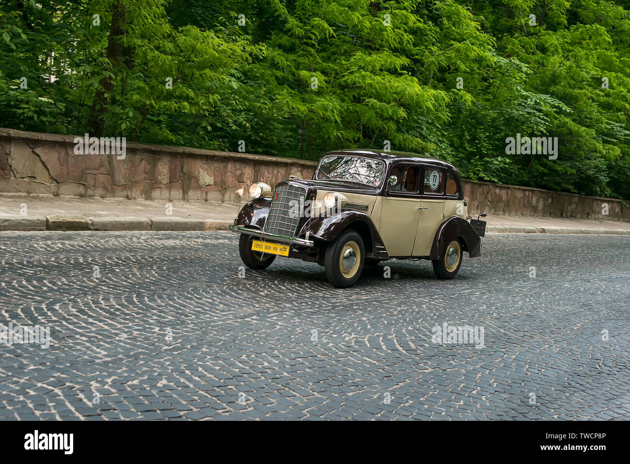 Lviv, Ukraine - June 2, 2019: Old retro car  Opel 1.3 mobel 1397 (1934) with its owner and  unknown passenger taking participation in race Leopolis gr Stock Photo