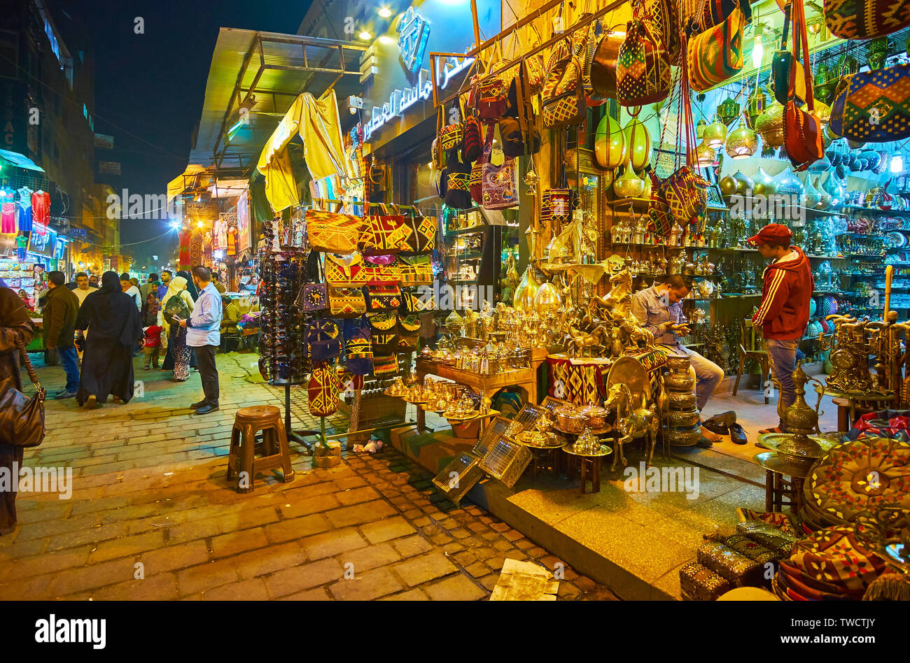 CAIRO, EGYPT - DECEMBER 22, 2017: Explore evening Al-Muizz street, lined with stalls of Souk Khan El Khalili Bazaar, full of local souvenirs, handicra Stock Photo