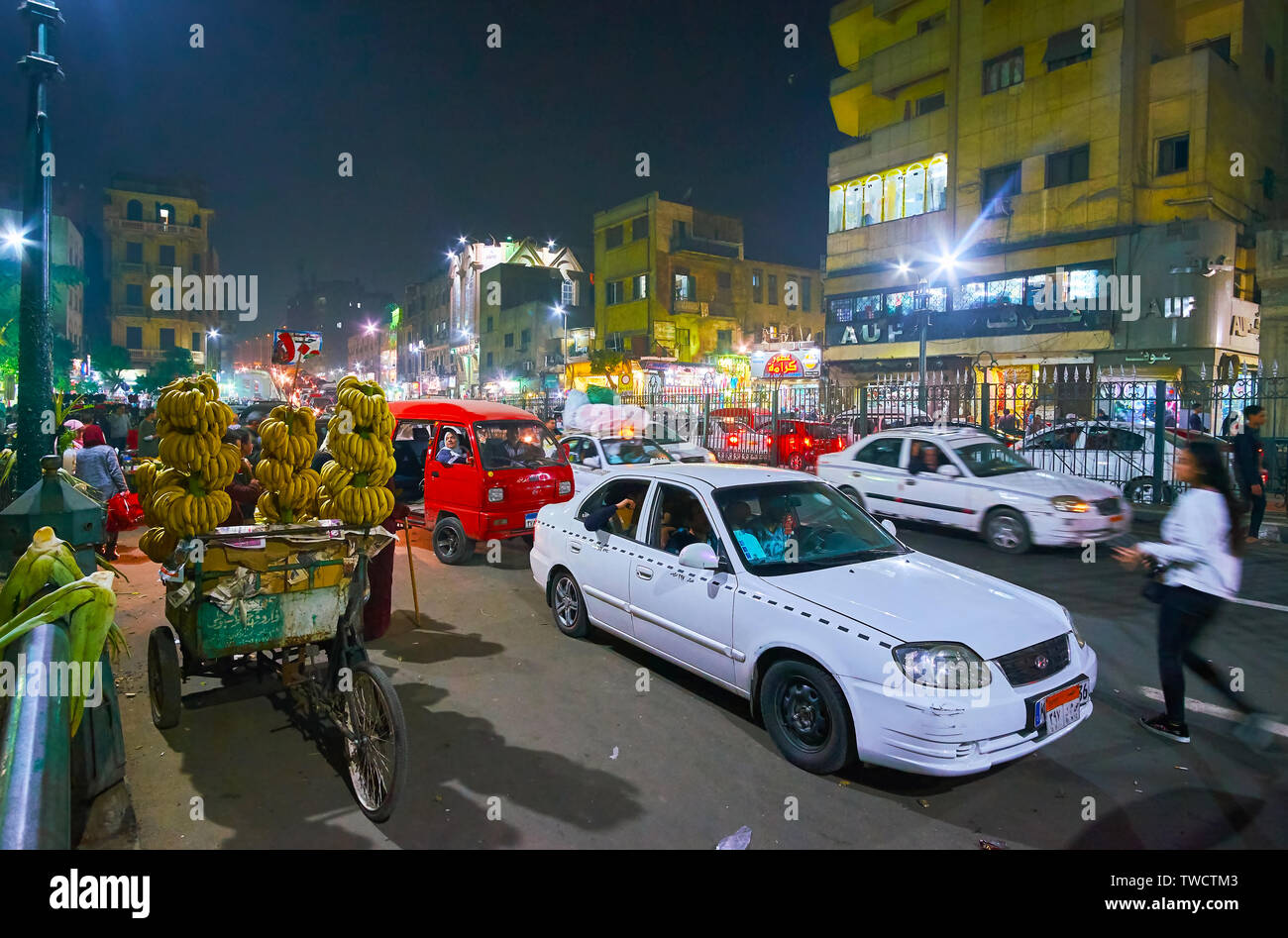 CAIRO, EGYPT - DECEMBER 22, 2017: The heavy evening traffic in Al Azhar avenue, full of stores, small stalls of old market and street vendors with the Stock Photo