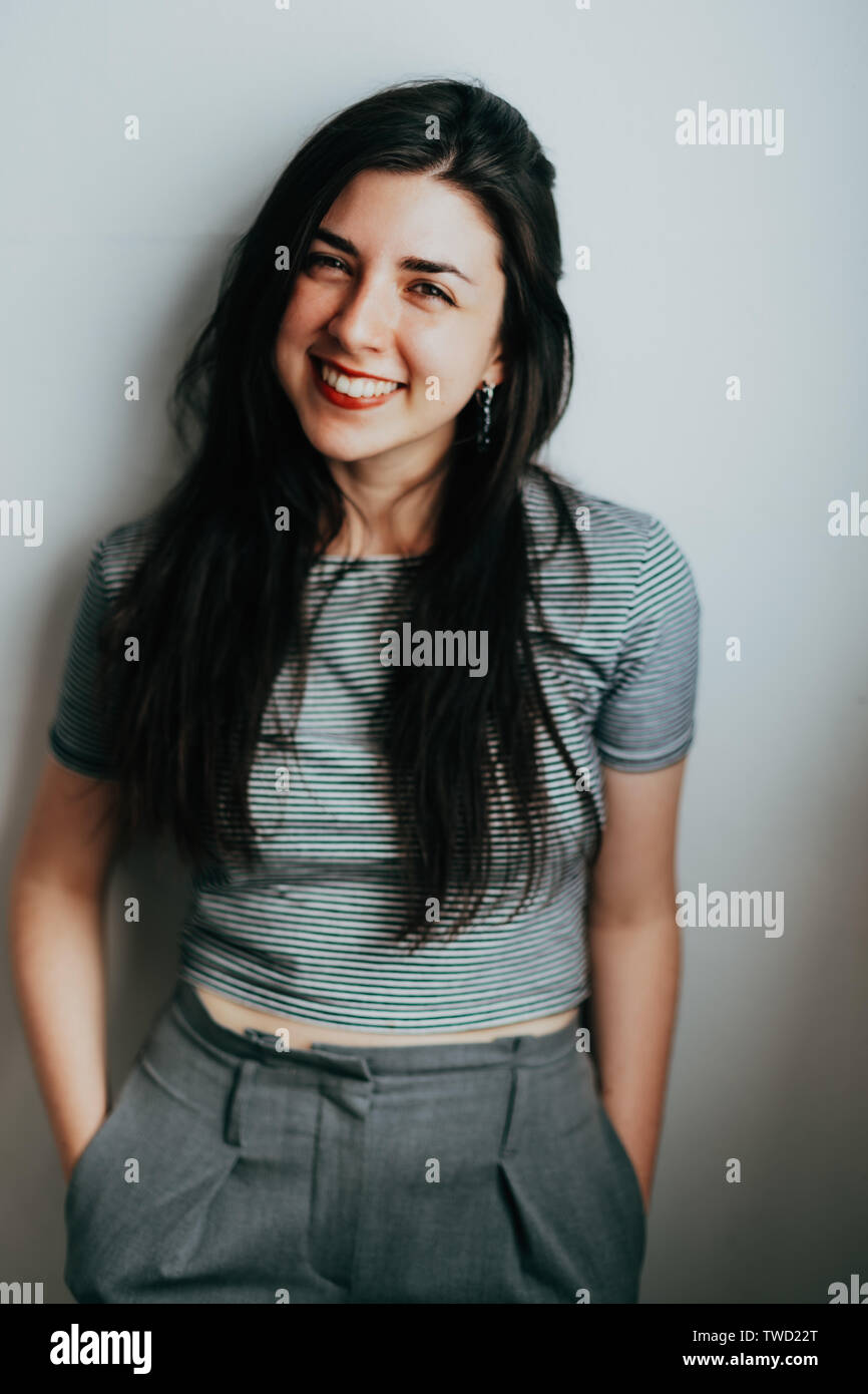 young confident brunette woman smiling Stock Photo