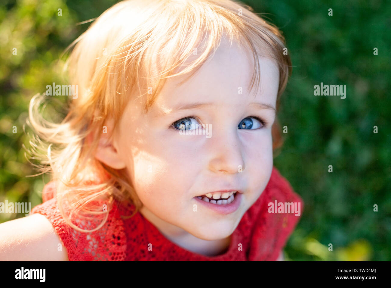 little kid pretty caucasian girl face closeup Stock Photo